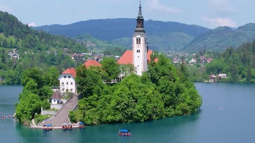 Aerial View of Church of Assumption of Mary in Center of Lake Bled Slovenia