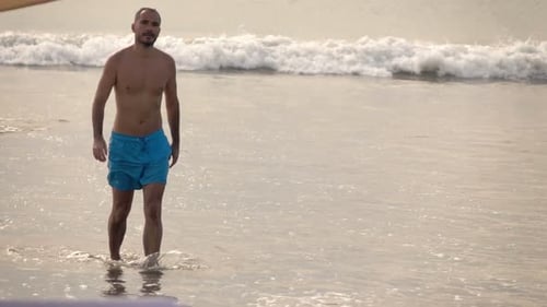 Young, Handsome Man Walking in Sea, Super 240