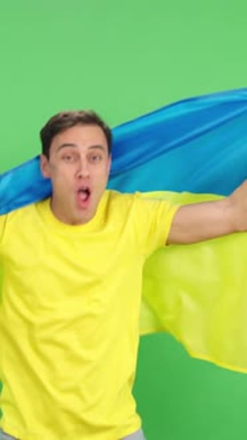 Young Adult Waving Flag on Green Screen