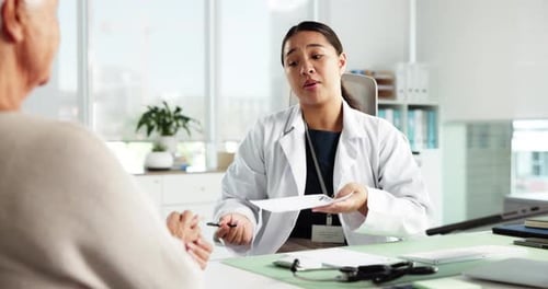 Doctor and Senior Patient Meeting in Office
