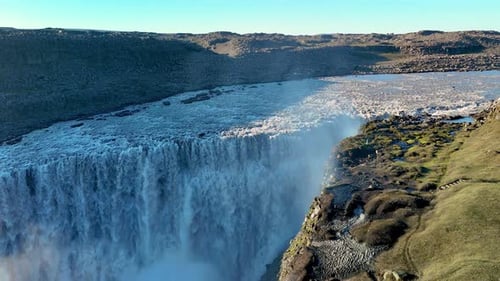 Majestic Dettifoss Waterfall Cascades Through Rugged Icelandic Landscape