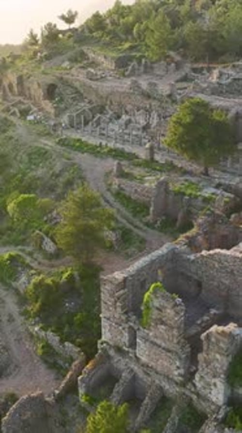 A Model Strolls Through History with the Beauty of the Sunset All Around Her