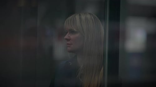 On a Bustling City a Blond Woman is Having a Depression at the Trainstation