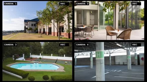 Four security camera views of luxury resort exterior, reception, pool and carpark, slow motion