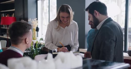 Happy Young Smiling Genz Business People Casually Sharing Ideas Brainstorming at Trendy Loft Light