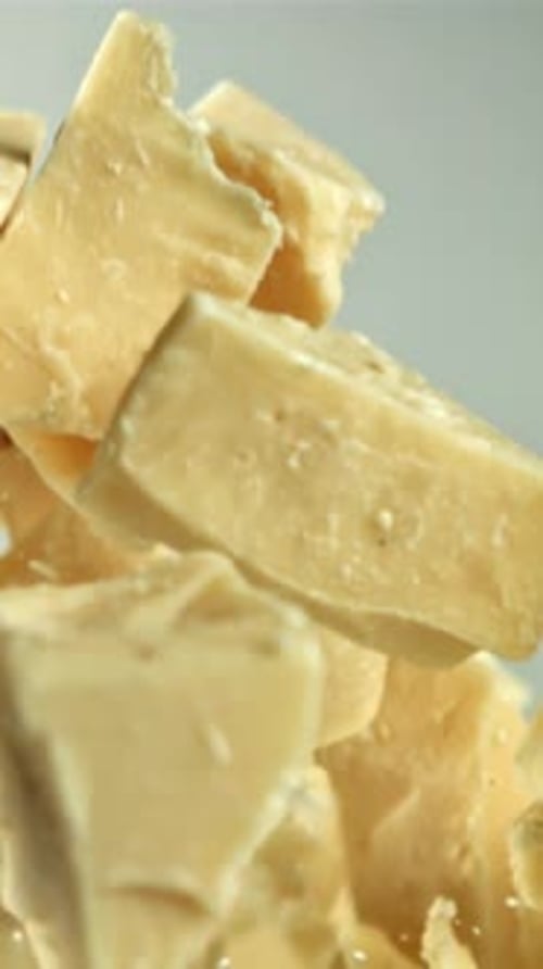 Pieces of White Chocolate Fly Up and Fall Down Filmed on a Highspeed Camera at 1000 Fps