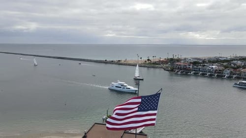 Scenic Harbor with Boats and American Flag