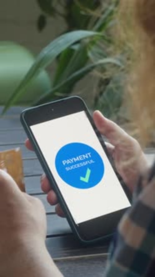 Vertical Video Woman Booking a Hotel Using Bank Card and Smartphone