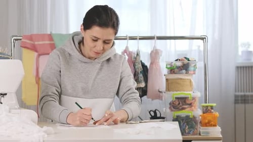 Tailor is Practicing Her Job at Working Place