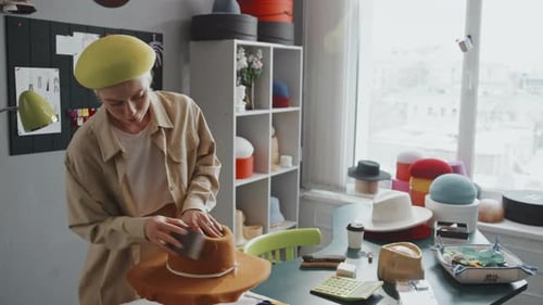 Woman Sands Hat in Sunny Millinery Studio