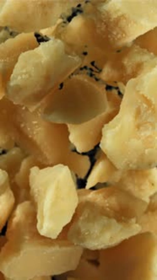 Parmesan Cheese Flies Up and Falls Down Filmed on a Highspeed Camera at 1000 Fps