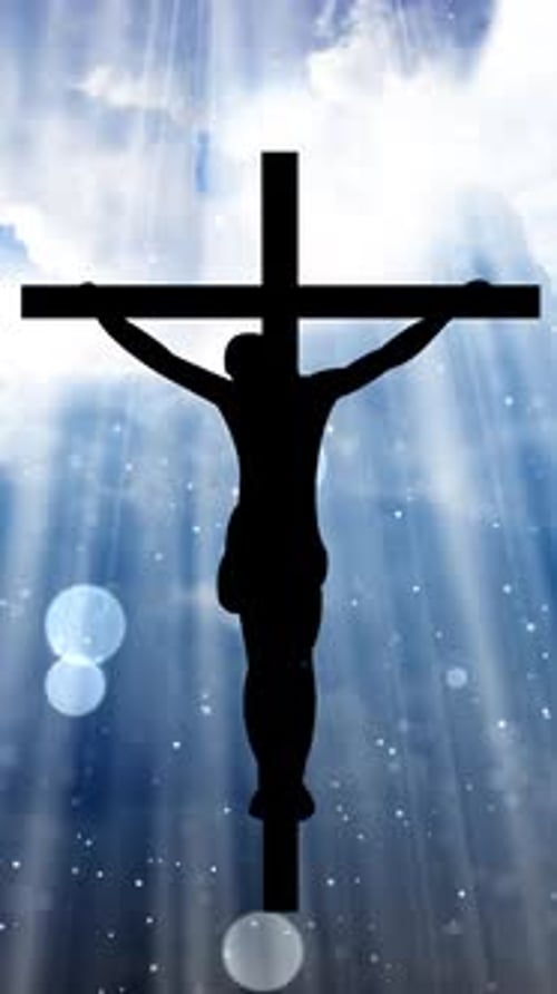 Jesus Christ Silhouette on Cross with Heavenly Light Rays and Particles