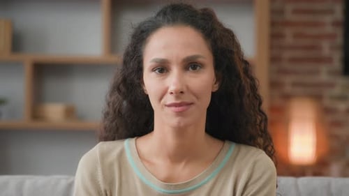 Close Up Indoors Portrait at Home Calm Caucasian Latina Lady with Curly Hair Posing