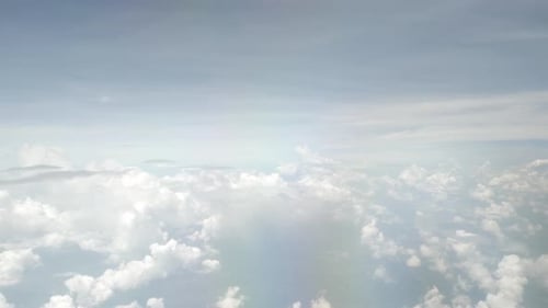view of sky with white puffy cloud and sun light above sky.cloudscape in summer