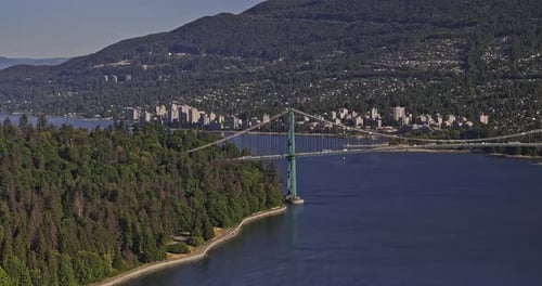 Vancouver BC Canada Aerial v77 flyover capturing traffic on Lions Gate Bridge linking Stanley Park a