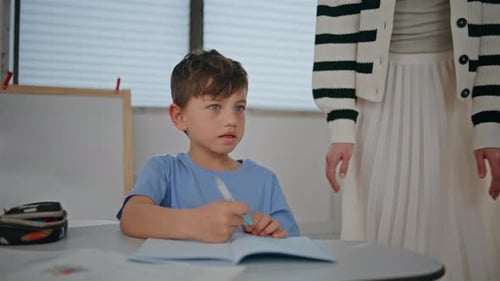 Smart Boy Writing Copybook at Lesson Closeup Small Schoolboy Learning Class