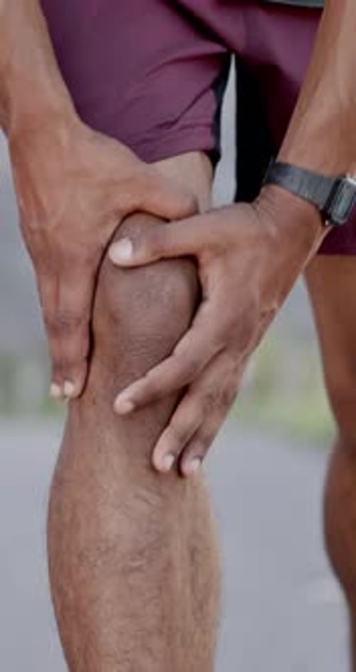 Hands, knee pain and fitness in city with injury on break, rest and stop for tension with exercise