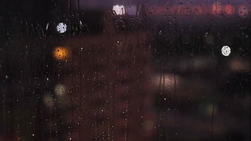 Rainy Weather and Lightning Outside Window View at Night