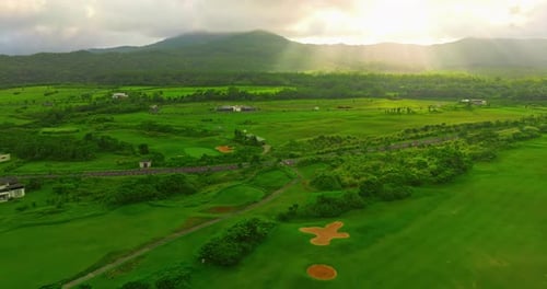 Aerial View of a Green Golf Course on a Sunny Day on Tropical Island Active Pastime in the Fresh Air