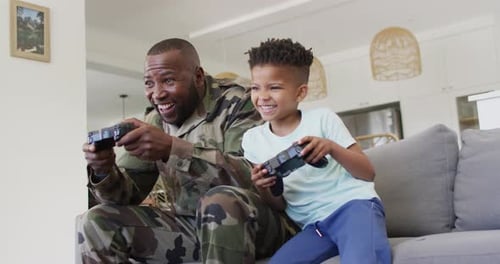 Father and Son Enjoying Video Games at Home