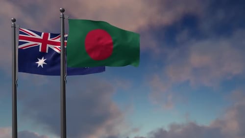Australia and Bangladesh Flags Waving Against Blue Sky