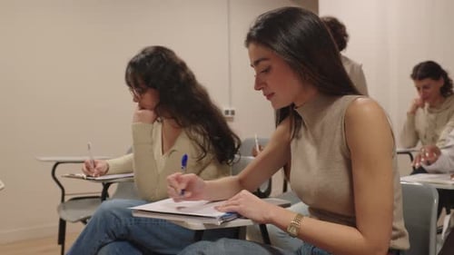 University Students Taking an Exam in a Classroom
