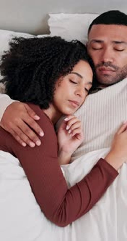 Couple Sleeping Together Cozy in White Bed