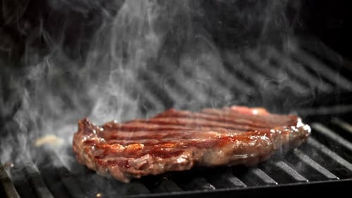 Succulent Steak Sizzling on a Grill