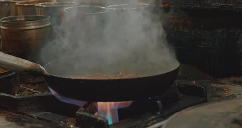 Man Cooking Street Food Biryani on a Busy Street Slow Motion Biryani is a Mixed Rice Dish Mainly