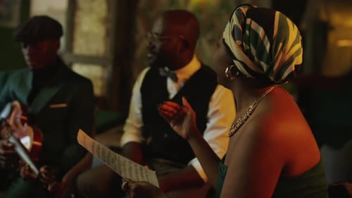 Musical Trio Revising Sheet Music in Lounge