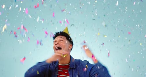 Happy man, dance or birthday confetti in studio for freedom, party celebration