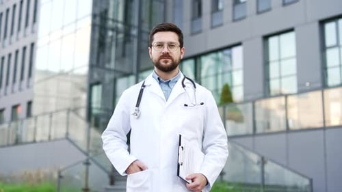 Confident Doctor with Stethoscope Outside Modern Hospital