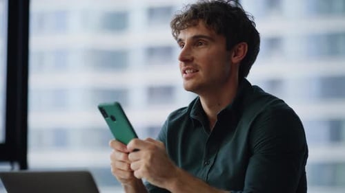 Smiling Employee Messaging Mobile Phone Sitting Company Office Closeup