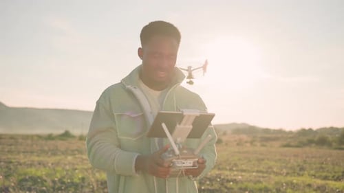 Drone Operator in a Beautiful and Scenic Agricultural Landscape Capturing Unique Perspectives