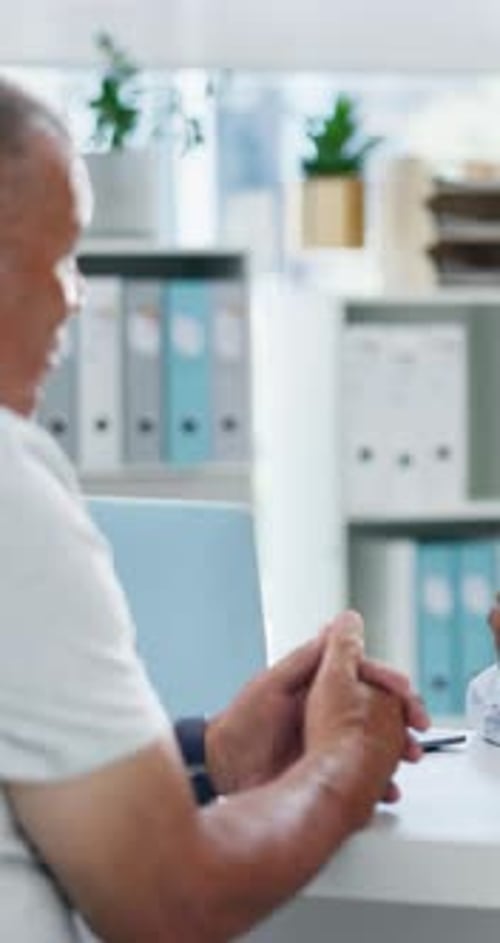 Doctor, consulting and tablet with old man in office for cancer screening