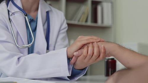 Doctor Examines Patient's Wrist Close Up