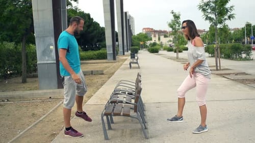 Joggers Stretching Legs On Bench In City, Super Slow Motion 120fps