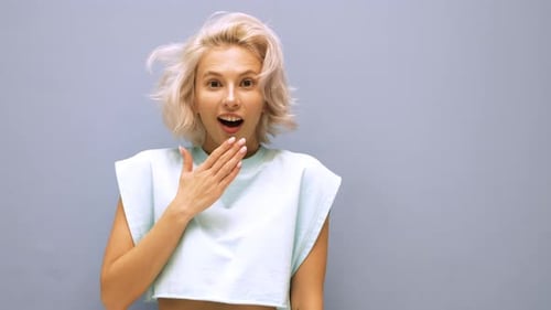 Young beautiful blond woman posing in studio