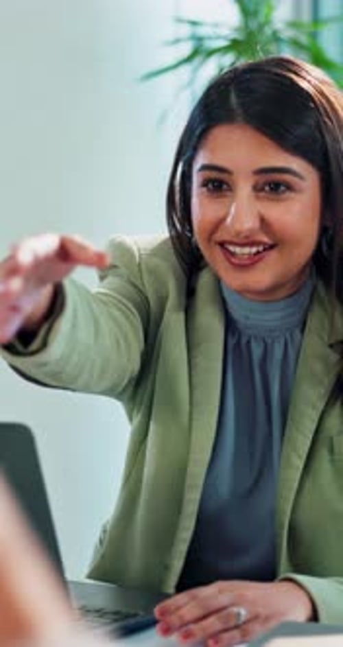 Businesswoman Shakes Hands, Claps at Office Desk