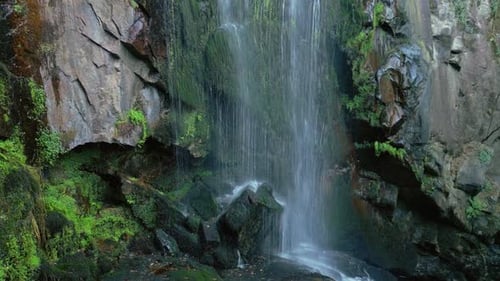 Close Up Of Waterfall Flowing Down On A Mossy And Rocky Cliffs.