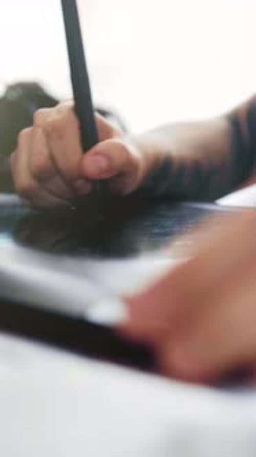 Hand Using Pen on Electronic Tablet Device