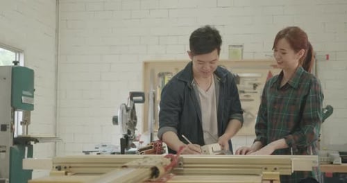 Two carpenter teamwork building design wood house model measure scale size
