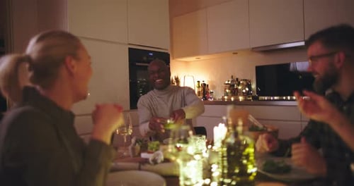 Friends Enjoying Dinner and Conversation in Modern Home