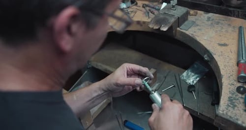 Jeweler Polishes a Ring During the Making Process in a Workshop