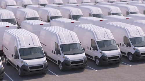 Delivery Vans in a Row on a Parking Express Delivery Service or Car Dealer Selling Concept
