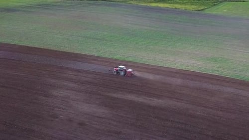 Tractor Plowing Aerial Shot. Drone Footage Of A Tractor Plowing A Field. Countryside Aerial Shot.