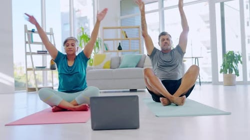 Couple Practices Gentle Yoga Exercises at Home