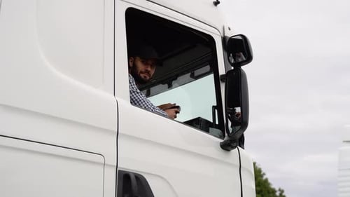 Truck Driver Man Sitting in Cabin Right Hand Drive Car