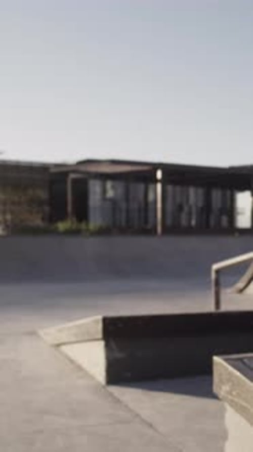 Man, action and trick with skateboard in city for training, jump and extreme sports from back