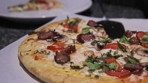 Fresh Pizza on the Table in the Restaurant